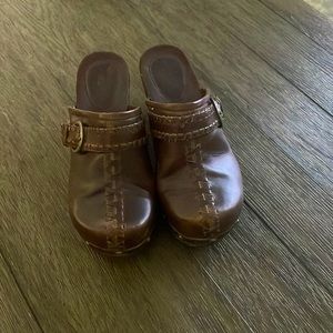 Clogs gently worn, scratches on driving heel